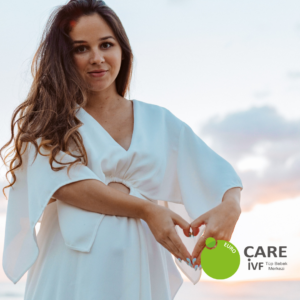 Mother in White Shirt Giving Heart Symbol after IVF Cyprus